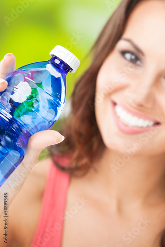 Photo: Young woman with water, outdoors Young woman with water, outdoors