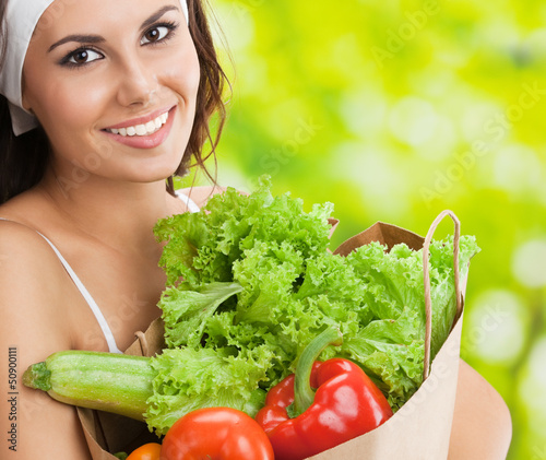 Photo: Woman in fitness wear with vegetarian food Woman in fitness wear with vegetarian food