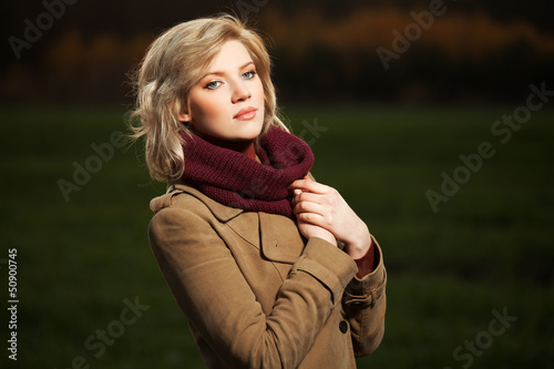 Photo: Young woman walking in autumn field Young woman walking in autumn field