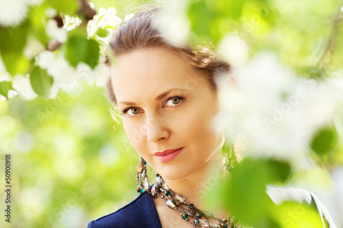 Photo: Beautiful woman in a spring garden Beautiful woman in a spring garden