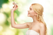 woman with dragonfly in hand