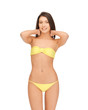 beautiful woman in bikini playing with hair