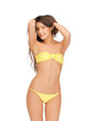 beautiful woman in bikini playing with hair