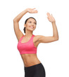 sporty woman in aerobic or dance movement