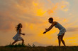 Happy daughter running to her mother on beautiful spring day
