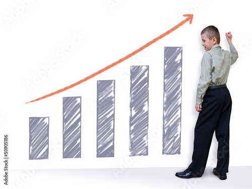 Photo: schoolboy draws a graph (with clipping path) schoolboy draws a graph (with clipping path)