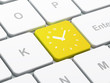 Time concept: Clock on computer keyboard background