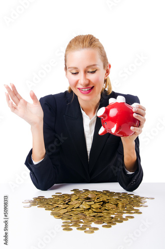 Photo: Woman breaking piggy bank for savings Woman breaking piggy bank for savings