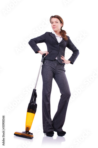 Photo: Young woman with vacuum cleaner on white Young woman with vacuum cleaner on white