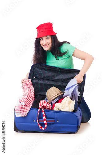 Photo: Young girl packing for vacation Young girl packing for vacation