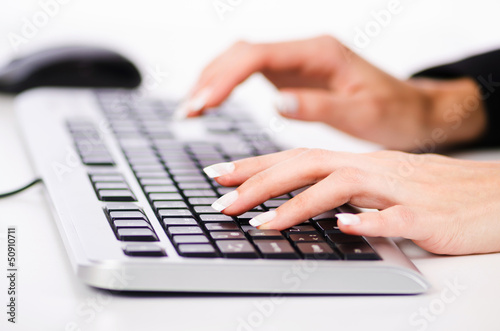 Photo: Hands working on the keyboard Hands working on the keyboard