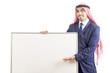 Arab man with blank board for message