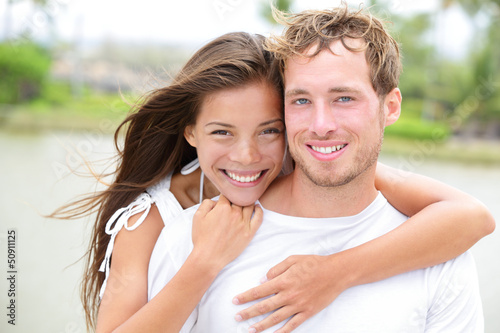 Photo: Young couple smiling happy portrait - interracial couple Young couple smiling happy portrait - interracial couple