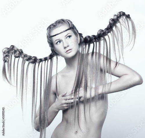 Photo: Portrait of young woman with braid hairdo Portrait of young woman with braid hairdo