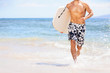 Beach fun surfer man running with bodyboard Beach fun surfer man running with bodyboard