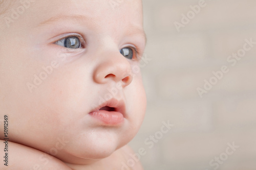 Photo: Close-up portrait focused kid with gray eyes. Close-up portrait focused kid with gray eyes.