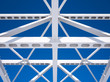 Steel beams against the blue sky. Fragment construction site.