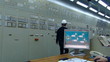 Industrial workers in a control room