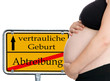 Photo: schwangere Frau und Schild - vertrauliche Geburt schwangere Frau und Schild - vertrauliche Geburt