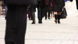 Feet of people going on the sidewalk