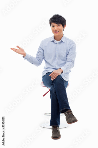 Photo: Asian man present something Asian man present something