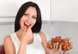 Photo: woman eating grapes woman eating grapes