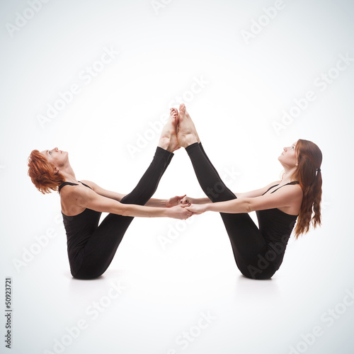 Photo: paired yoga on a blue background paired yoga on a blue background