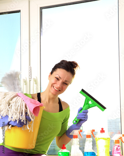 Photo: Women cleaning a window Women cleaning a window