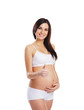 Young attractive pregnant woman with the beautiful belly