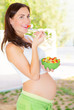 Pregnant girl having breakfast