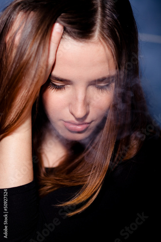 Photo: Marijuana user getting high, puffing smoke Marijuana user getting high, puffing smoke