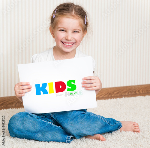 Photo: little girl with the sheet of paper little girl with the sheet of paper