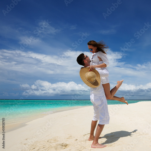 Photo: Couple on a beach at Maldives Couple on a beach at Maldives