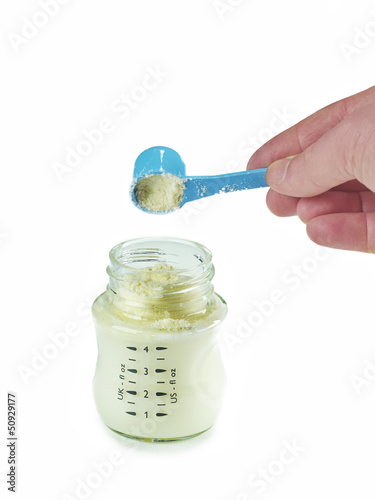 Photo: Powdered milk dairy food for baby and Baby bottle. Powdered milk dairy food for baby and Baby bottle.