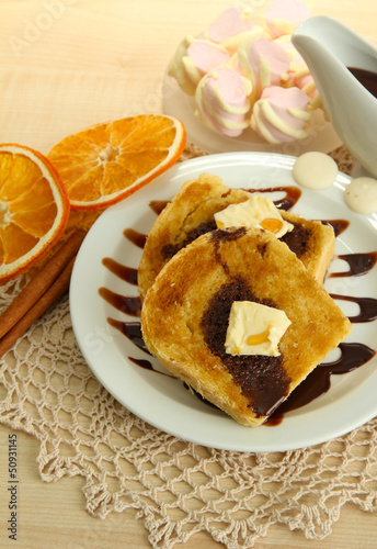 Photo: White bread toast with chocolate on wooden table White bread toast with chocolate on wooden table