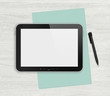Blank digital tablet on a white desk