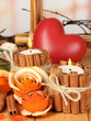 Decorative rose from dry orange peel and burning candles