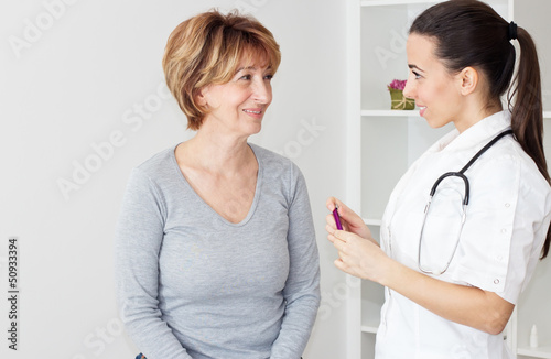 Photo: Mature woman with her female doctor. Mature woman with her female doctor.