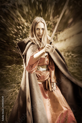 Photo: woman warrior with sword woman warrior with sword