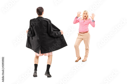 Photo: Full length portrait of a flasher scaring a young woman Full length portrait of a flasher scaring a young woman