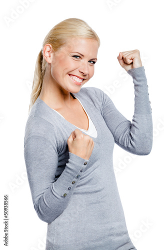 Photo: Happy girl in gray sweater with her fists up, isolated on white Happy girl in gray sweater with her fists up, isolated on white