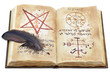 Photo: Magic book with feather isolated Magic book with feather isolated