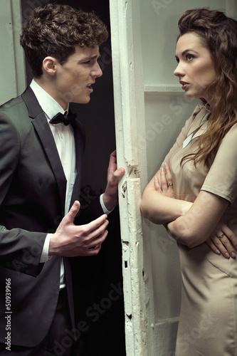 Photo: Attractive couple having a serious argument Attractive couple having a serious argument