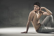 Calm muscular man looking for something