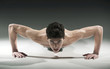 Muscular young man pressing-ups Muscular young man pressing-ups