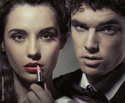 Photo: Attractive couple opposite the mirror Attractive couple opposite the mirror