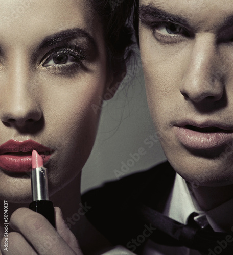 Photo: Portrait of a woman and man with lipstick Portrait of a woman and man with lipstick