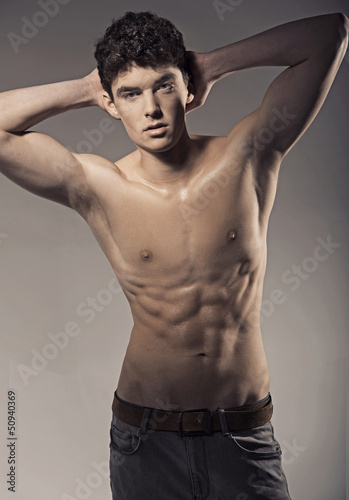 Photo: Young handsome athlete in nice pose Young handsome athlete in nice pose