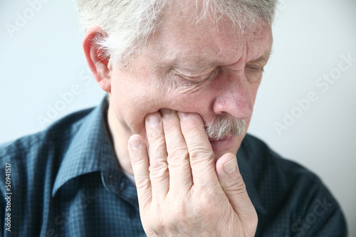 Photo: man suffers from face pain man suffers from face pain