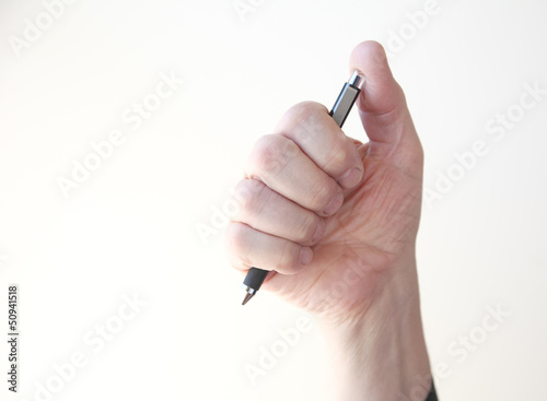 Photo: man holding pen man holding pen